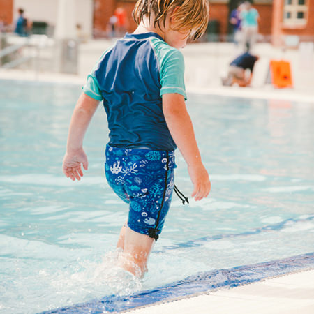 Conni swim shorts worn beside the water