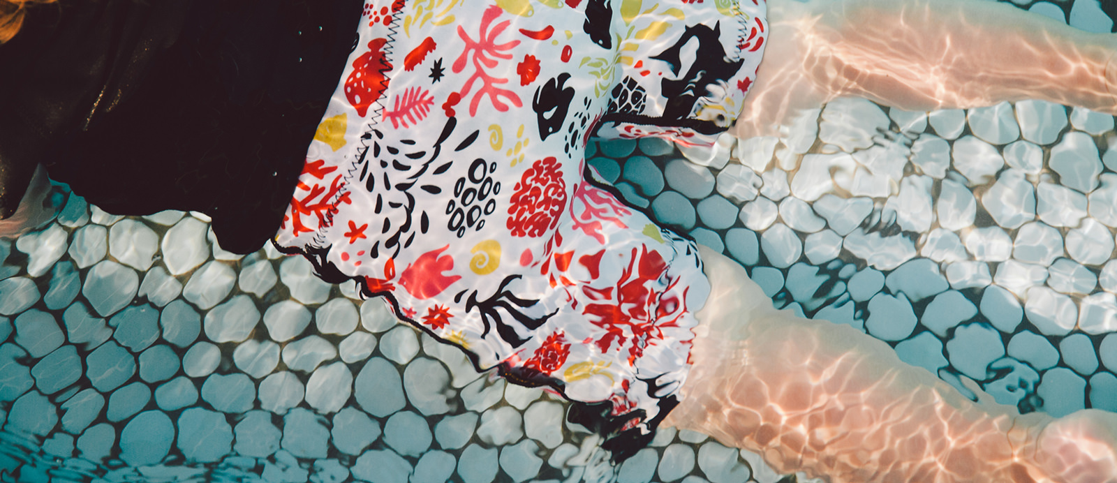 Close-up of Conni swim shorts in the water